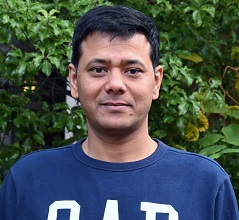 headshot of Manik Ghosh